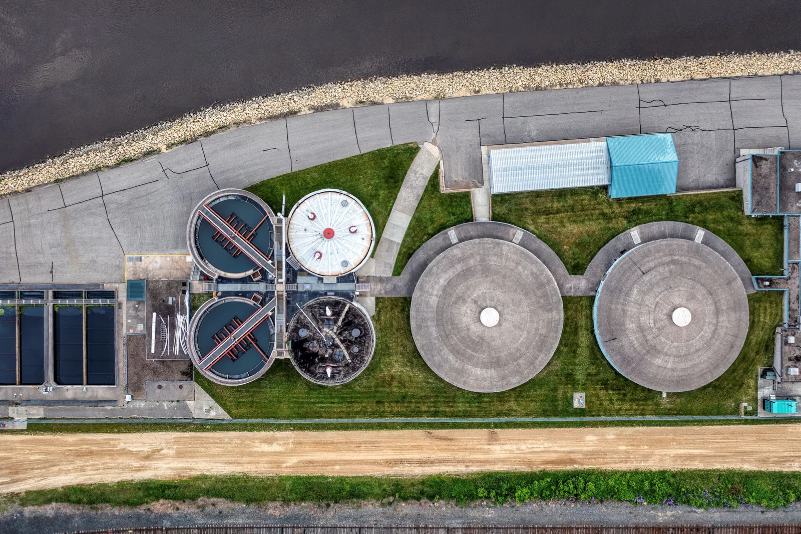 Aerial view of an industrial wastewater treatment facility near a river